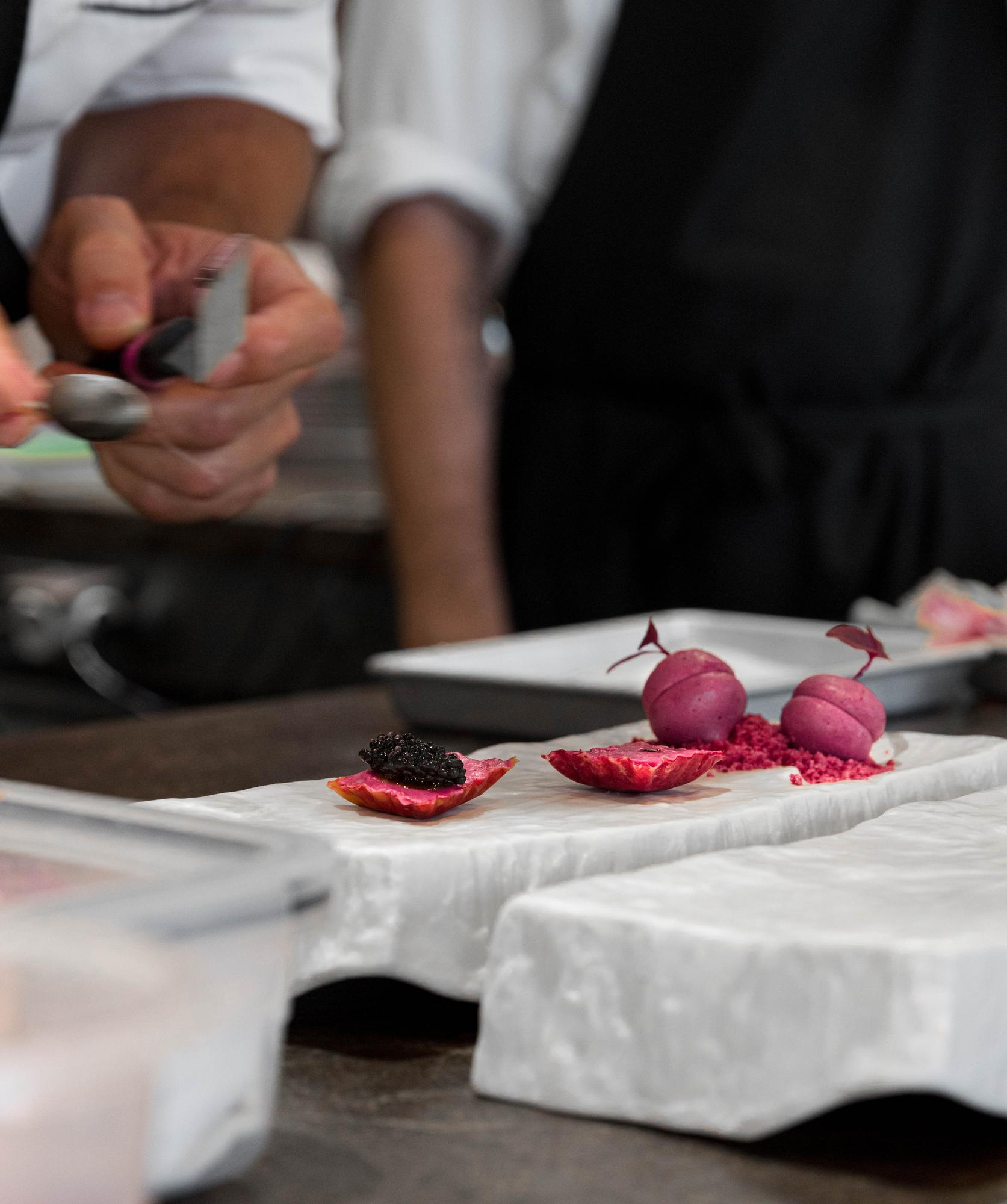 Attentive chef teaching small group in workshop